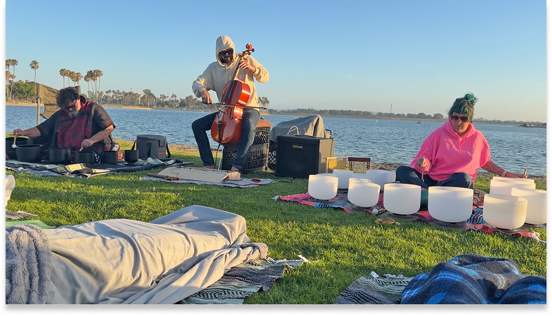 Sunset Soundbath gathering by the water